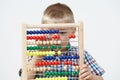 Studio Shot Of Boy Playing With Abacus Royalty Free Stock Photo