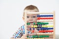 Studio Shot Of Boy Playing With Abacus Royalty Free Stock Photo