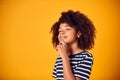 Studio Shot Of Boy With Puzzled Expression Thinking Against Yellow Background Royalty Free Stock Photo