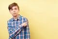 Studio shot of boy with surprised face expression