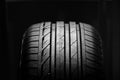Studio shot of brand new car tire isolated on black background. close up Royalty Free Stock Photo