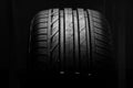 Studio shot of brand new car tire isolated on black background. close up Royalty Free Stock Photo