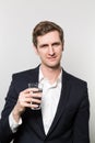 Studio shot of businessman with a glas of sparkling water Royalty Free Stock Photo