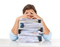 The paperwork just keeps piling up. Studio shot of a businessman sitting with a pile of files and looking demotivated Royalty Free Stock Photo