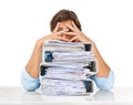 The paperwork just keeps piling up. Studio shot of a businessman sitting with a pile of files and looking demotivated