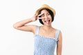 Studio shot of cheerful beautiful Asian woman in blue color dress and wearing a hat and stand on white background.