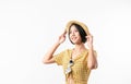 Studio shot of cheerful beautiful Asian woman in yellow color dress and wearing a hat and stand on white background.