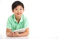 Studio Shot Of Chinese Boy With Digital Tablet Royalty Free Stock Photo