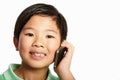 Studio Shot Of Chinese Boy With Mobile Phone Royalty Free Stock Photo