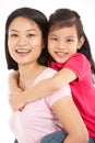 Studio Shot Of Chinese Mother And Daughter Royalty Free Stock Photo