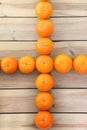 Citrus tankan cross against wooden background