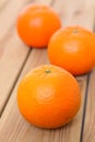 Citrus tankan against wooden background