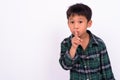 Studio shot of cute Asian boy against white background