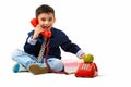 Studio shot of cute happy boy smiling while talking on old telep Royalty Free Stock Photo