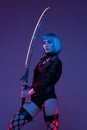 Combative cyberpunk woman with sword indoors studio