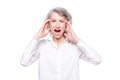 Studio shot of distressed irritated senior woman losing temper screaming out loud from pain and holding hands on head Royalty Free Stock Photo