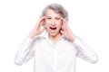 Studio shot of distressed irritated senior woman losing temper screaming out loud from pain and holding hands on head Royalty Free Stock Photo