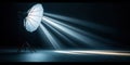 Studio shot of empty space illuminated by spotlight. Light beam projects dramatic effect on dark floor. Pro photo studio setup. Royalty Free Stock Photo