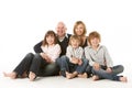 Studio Shot Of Family Group Sitting