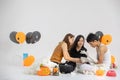 Studio shot of family, two woman and one boy, preparing fancy co Royalty Free Stock Photo