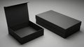 Two minimalist black packaging boxes, one open and one closed, displayed on a neutral surface isolated on white background Royalty Free Stock Photo