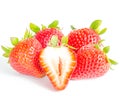 Studio shot four whole organic strawberries with a half cut isolated on white Royalty Free Stock Photo