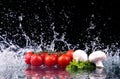 Studio shot with freeze motion of cherry tomatoes Royalty Free Stock Photo