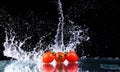 Studio shot with freeze motion of cherry tomatoes Royalty Free Stock Photo