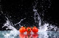 Studio shot with freeze motion of cherry tomatoes Royalty Free Stock Photo