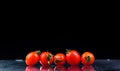 Studio shot with freeze motion of cherry tomatoes Royalty Free Stock Photo