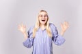 Attractive young woman posing over grey background