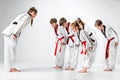 The studio shot of group of kids training karate martial arts