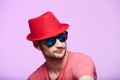 Studio shot of handsome bearded man wearing red fedora hat. Royalty Free Stock Photo