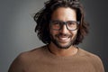 Frames that make a clear statement. Studio shot of a handsome young man wearing glasses against a gray background. Royalty Free Stock Photo