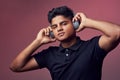 I like a good beat. Studio shot of a handsome young man wearing headphones. Royalty Free Stock Photo
