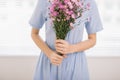 Studio shot of happiness woman receiving pretty flowers Royalty Free Stock Photo