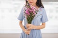 Studio shot of happiness woman receiving pretty flowers Royalty Free Stock Photo