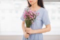 Studio shot of happiness woman receiving pretty flowers Royalty Free Stock Photo