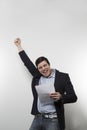 Studio shot of happy businessman celebrating a paper Royalty Free Stock Photo