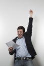 Studio shot of happy businessman celebrating a paper Royalty Free Stock Photo