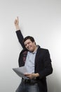 Studio shot of happy businessman celebrating a paper Royalty Free Stock Photo