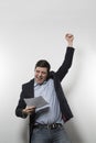 Studio shot of happy businessman celebrating a paper Royalty Free Stock Photo