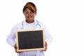 Studio shot of happy fat black African woman doctor smiling and Royalty Free Stock Photo