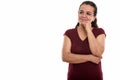 Studio shot of happy mature Persian woman smiling while thinking Royalty Free Stock Photo