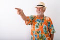 Happy senior bearded tourist man smiling while pointing finger Royalty Free Stock Photo