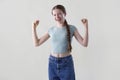 Studio Portrait Of Happy Smiling And Confident Teenage Girl With Arms Outstretched Looking At Camera Royalty Free Stock Photo