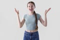 Studio Portrait Of Happy Smiling And Confident Teenage Girl With Arms Outstretched Looking At Camera Royalty Free Stock Photo