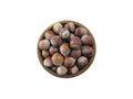 Studio shot of hazelnuts on white background. Heap of hazelnut in nutshell isolated on white. Nuts in a bowl with copy space for t Royalty Free Stock Photo