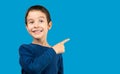 child standing over isolated blue