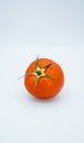 Red tomato against white background Royalty Free Stock Photo